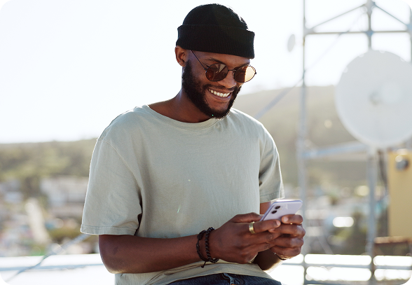 Man smiling at phone